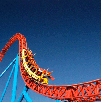 A roller coaster with a blue sky