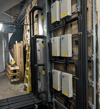 Photo of air-cooled VRV systems inside the existing building ductwork.