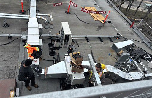 Photo of HVAC workers doing work at Toronto Community Housing