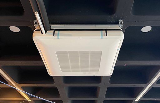 Image of a Daikin Ceiling Cassette unit on ceiling.