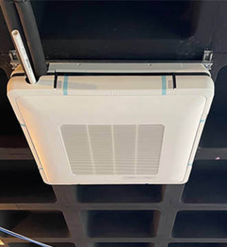 Image of a Daikin Ceiling Cassette unit on ceiling.