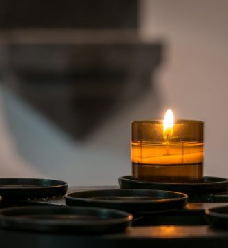 Candle burning on stone